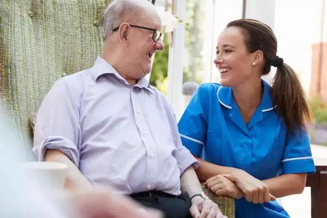 nurse with community member after successfully connecting via hosted GP surgery telephony