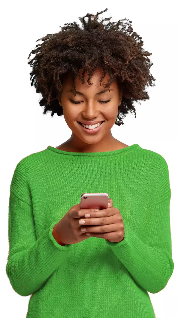 a woman in a green jumper with a phone