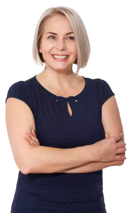 woman with short blond hair, arms crossed, smiling keeping connected with a hosted telephony system for GPs