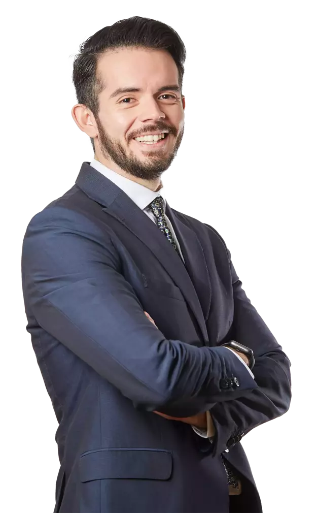 male GP manager in suit arms crossed, smiling, staying connected via a hosted telephony system