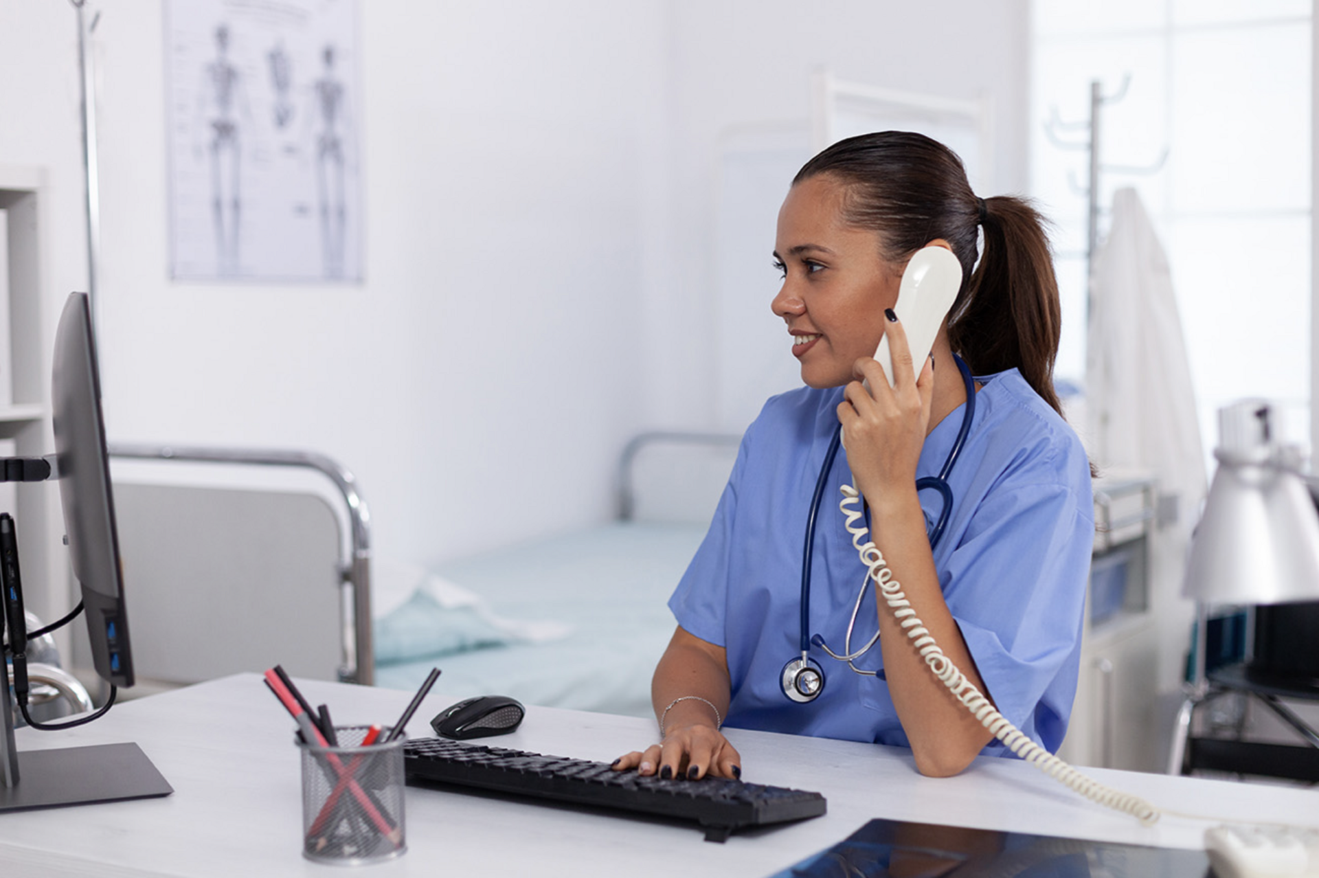 
                a doctor on the phone at a desk
              