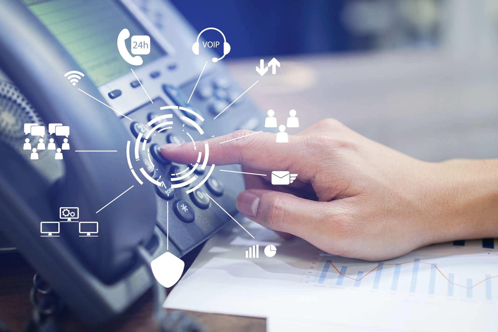 
                A desktop hardphone in use, with symbols representing the advanced functionality of cloud-based telephony
              