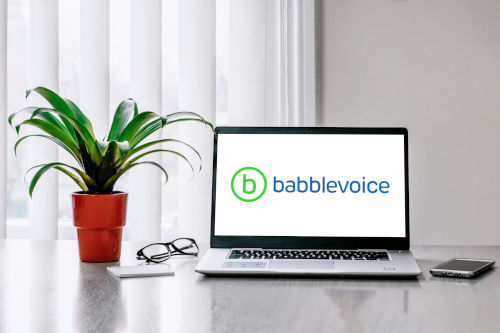 
                      a laptop showing the babblevoice logo
                    