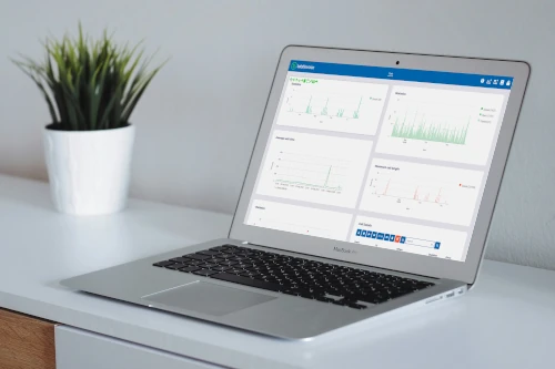 
                      A laptop on a desk showing a dashboard of statistics in babblevoice Vibes
                    